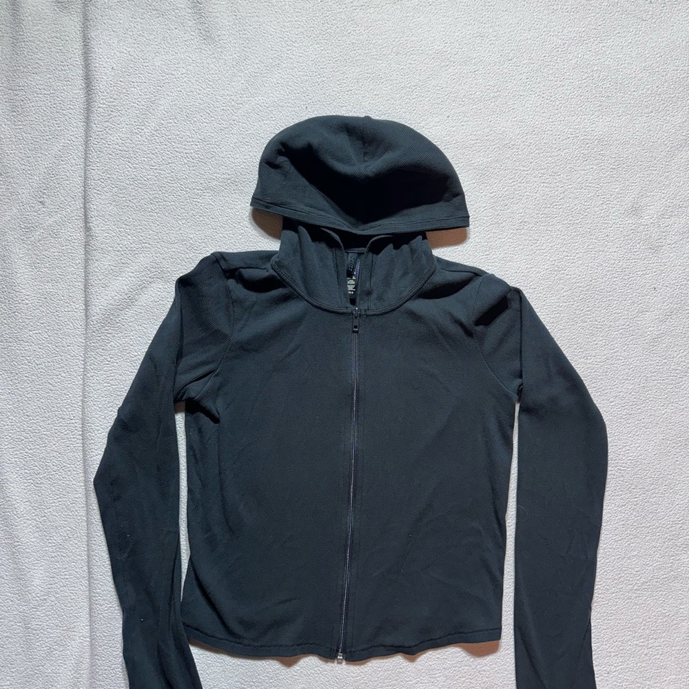 Skims weightless layer zip up hooded jacket. This is tshirt thin.